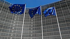 European Union flags outside the EU Commission headquarters in Brussels