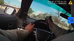 Watch: Officer fires through window in Las Vegas car chase 