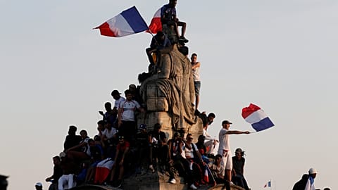 Fans welcome their World Cup champions on the Champs Elysees