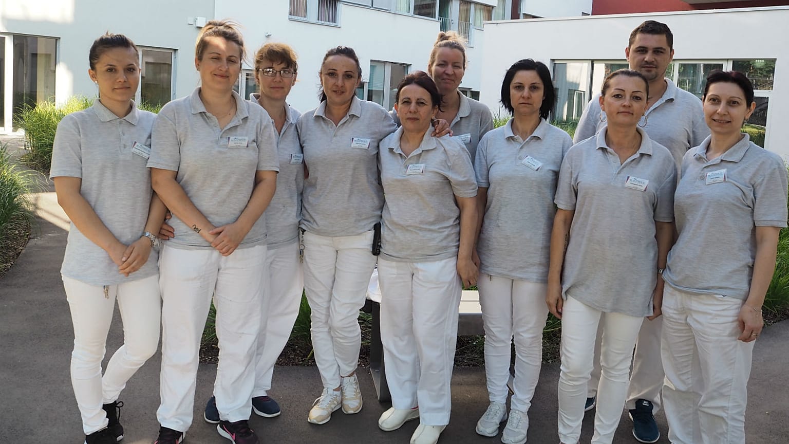 Juliana and her colleagues outside the hospital where she works
