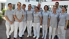 Juliana and her colleagues outside the hospital where she works
