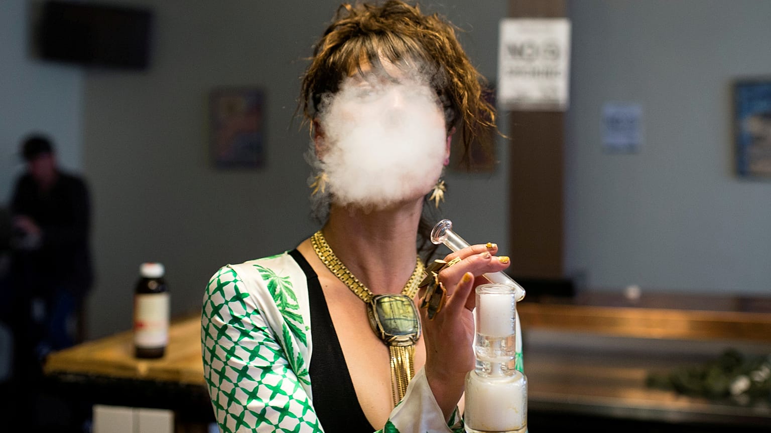 Elise McRoberts exhales at the Magnolia vape lounge in Oakland, CA