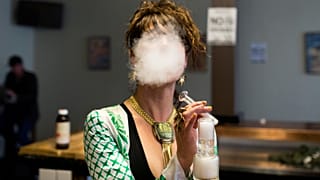 Elise McRoberts exhales at the Magnolia vape lounge in Oakland, CA