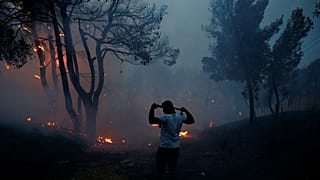 Greece appeals for help after deadly fires ravage coast