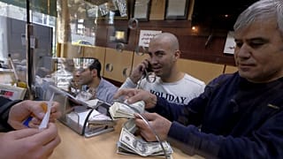 Iran's currency hits record low amid impending US sanctions
