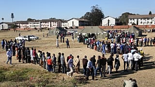 Voters queue to cast ballots in Harare, 30 July 2018