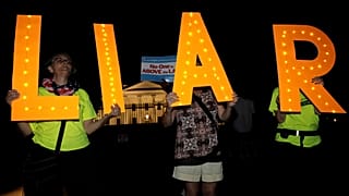 Protesters rally outside the White House in Washington on 16 July, 2018.