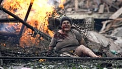 An injured Georgian woman shouts in the town of Gori on August 9 2009