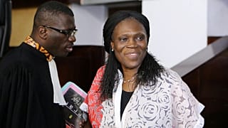 Ivory Coast's former first lady Simone Gbagbo (R), who is accused of crime