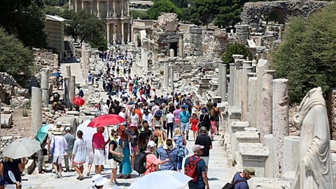 Tourists visit the ancient city of Ephesus near Izmir in Turkey
