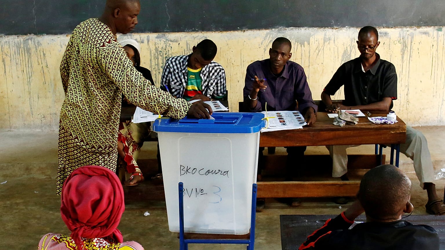 A man casts his ballot at a polling station in Mali