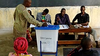 A man casts his ballot at a polling station in Mali