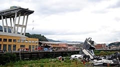 Rescue workers are seen at the collapsed Morandi Bridge near Genoa, Italy