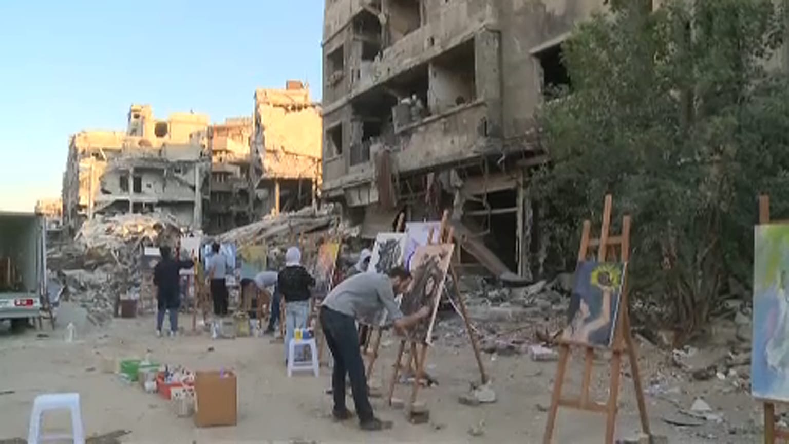 Refugee artists return to Yarmouk camp in Syria to paint dreams