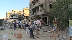 Refugee artists return to Yarmouk camp in Syria to paint dreams