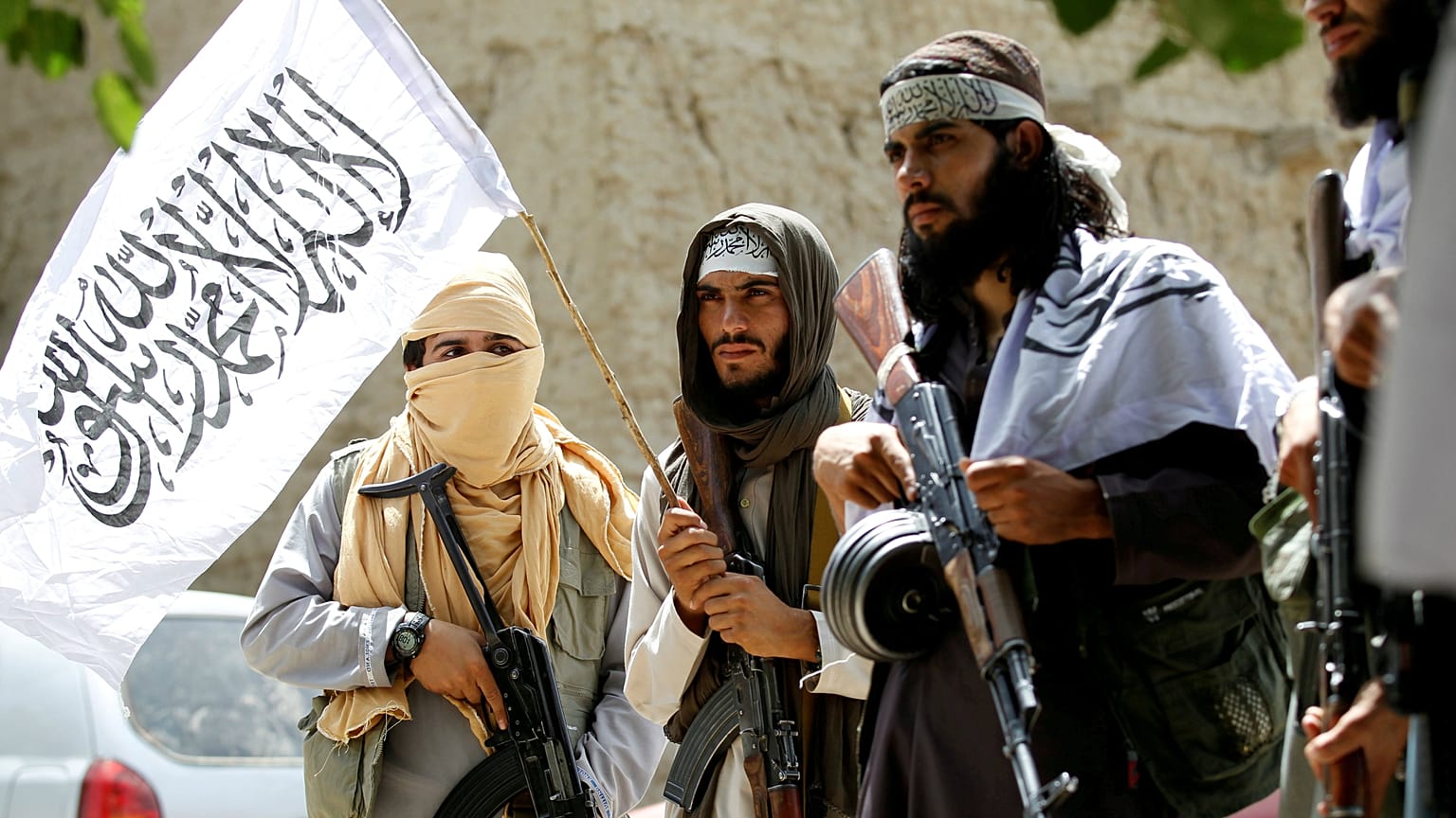 Taliban walk as they celebrate ceasefire in Ghanikhel district of Nangarha