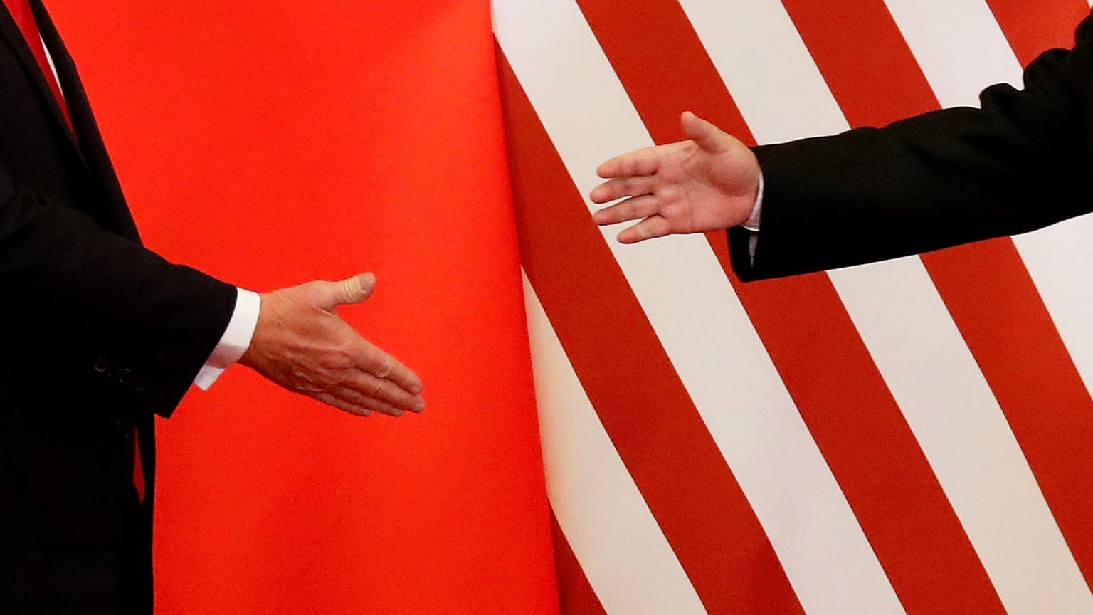 U.S. President Donald Trump and China's President Xi Jinping shake hands