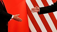 U.S. President Donald Trump and China's President Xi Jinping shake hands