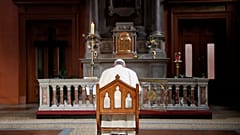 Pope Francis lights a candle and says a prayer for abuse victims in Ireland