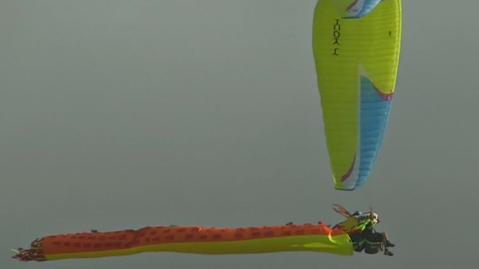 Watch: Costume-clad paragliders descend over the Andes