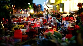 Right-wing supporters protest after a German man was stabbed last weekend