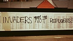 ‘Invaders not refugees’: UK migrant memorial defaced again