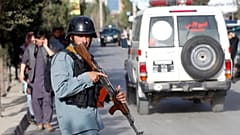 An Afghan policeman near the site of a suicide bomb blast in Kabul.