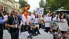 Students get perfect mix of bed and protest in Lennon-inspired NYC event