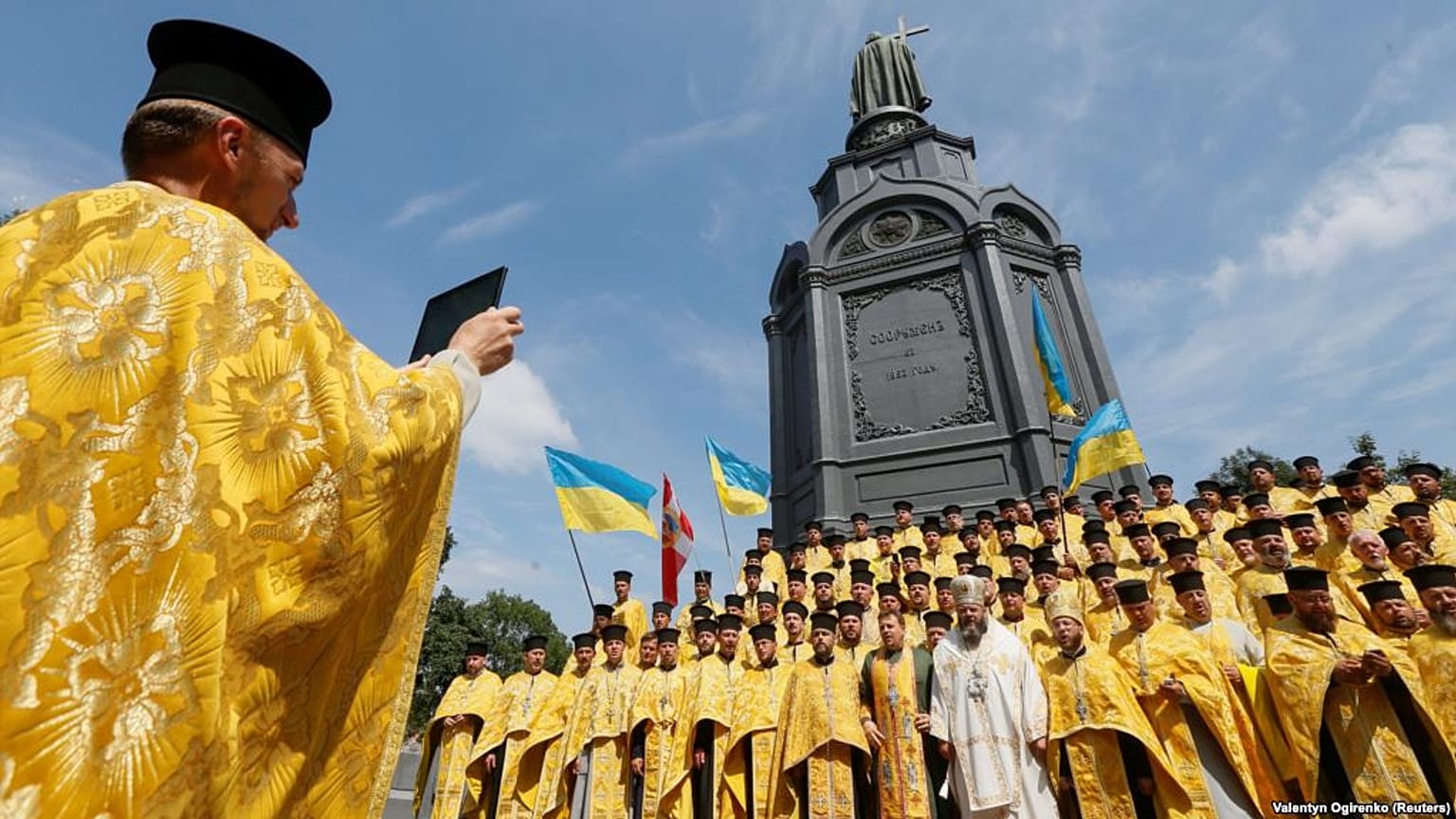 Clergymen from the Ukrainian Orthodox Church of the Kyiv Patriarchate take 