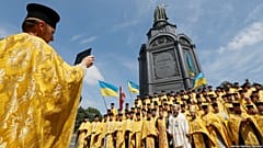Clergymen from the Ukrainian Orthodox Church of the Kyiv Patriarchate take 