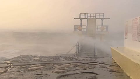Woman dies as caravan blown onto beach by Storm Ali