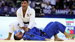Saeid Mollaei of Iran in action against Anri Egutidze (blue) of Portugal