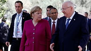 Angela Merkel stands next to Israeli President Reuven Rivlin