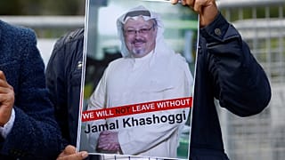 A demonstrator holds picture of Saudi journalist Jamal Khashoggi