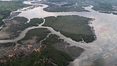  the Niger delta where signs of oil spills can be seen in Port Harcourt