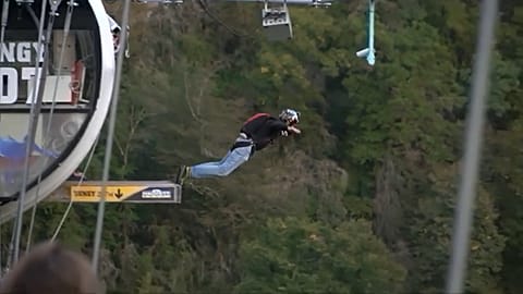 Dozens leap off bridge in Sochi annual base jump festival