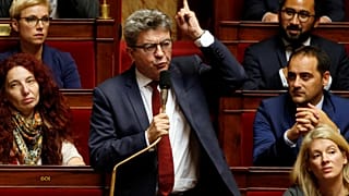 Raw Politics: French left leader Jean-Luc Mélenchon reacts angrily to police raids