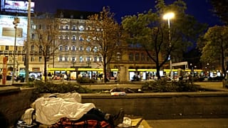 A homeless woman lies on the street in Budapest, Hungary, October 14, 2018.
