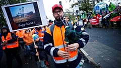 Employees of German utility RWE attend a labour protest, as environmentalis