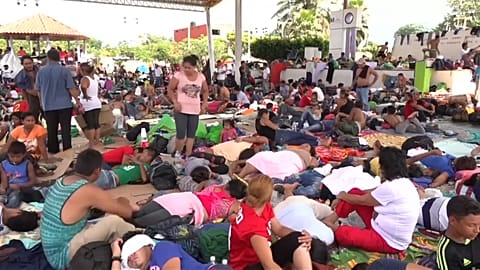 Migrants find a brief moment of rest in Mexican town