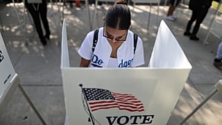 A voter makes her choice in the US midterm elections.