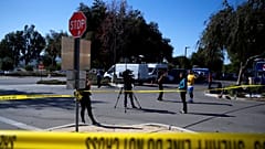 Media is seen outside a reception centre for families of victims of a mass 