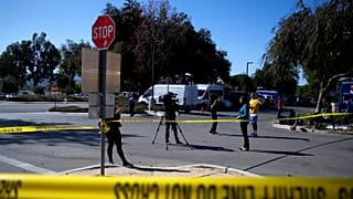 Media is seen outside a reception centre for families of victims of a mass 