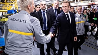 Macron defies hecklers