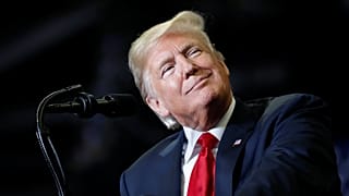 President Donald Trump acknowledges supporters at a campaign rally.