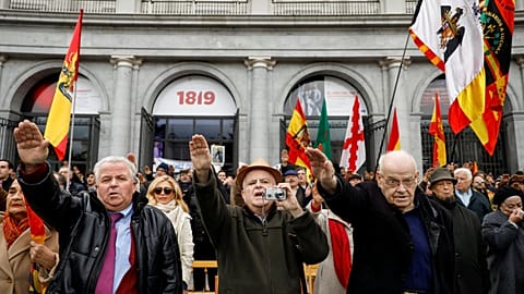 Supporters of Spain's late dictator Francisco Franco give fascist salutes