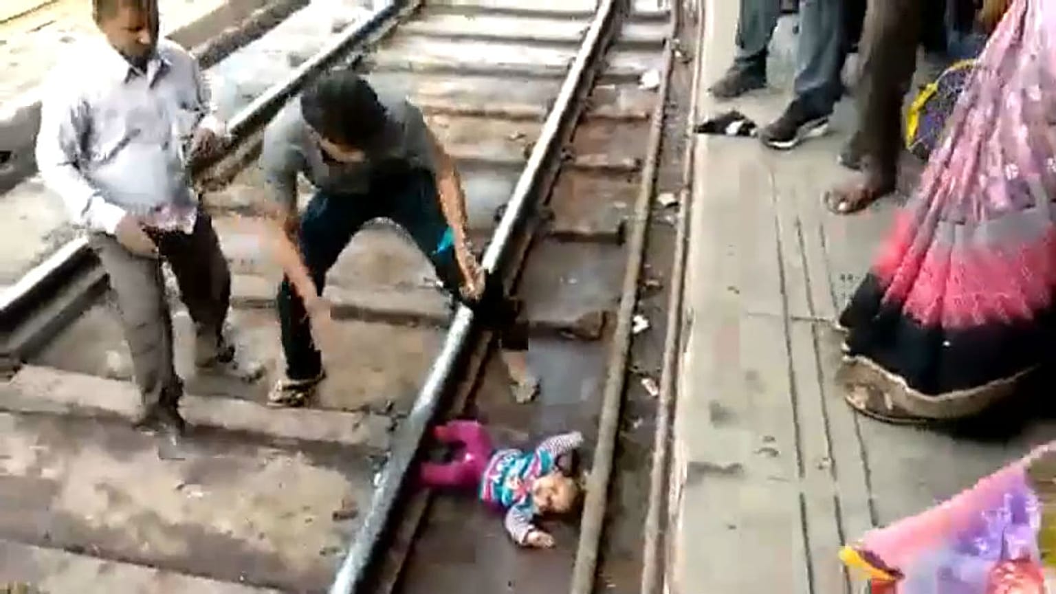 Watch: Baby in India survives after being 'run over' by train