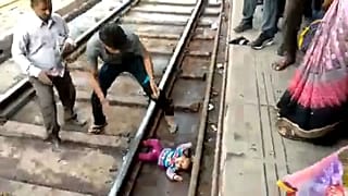 Watch: Baby in India survives after being 'run over' by train