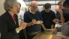 Theresa May gives a press conference on board her plane
