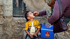 Boy receives polio vaccine drops, Karachi, Pakistan April 9, 2018.